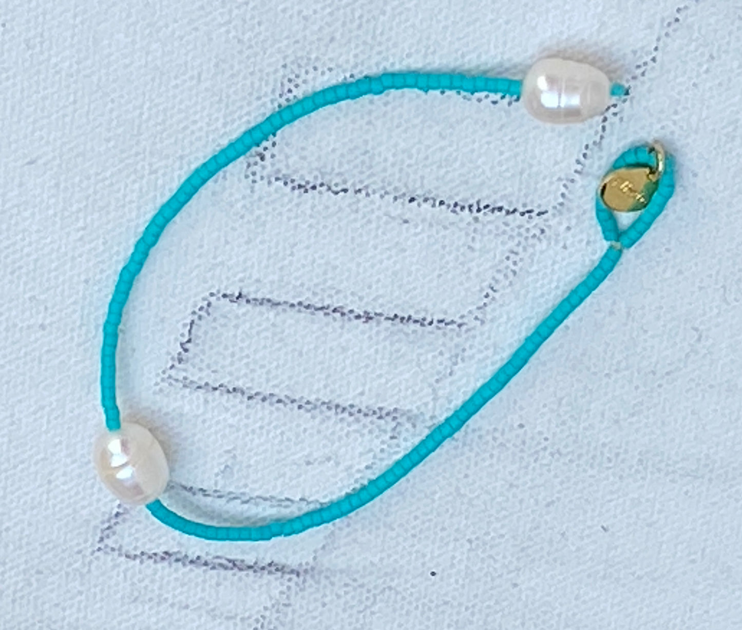 Miyuki turquoise blue bracelet with white baroque pearl.
