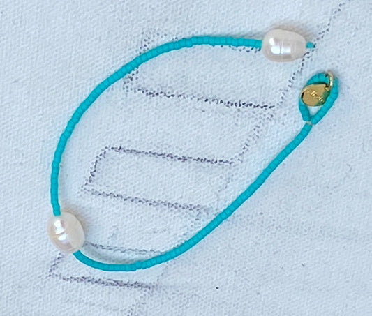 Miyuki turquoise blue bracelet with white baroque pearl.